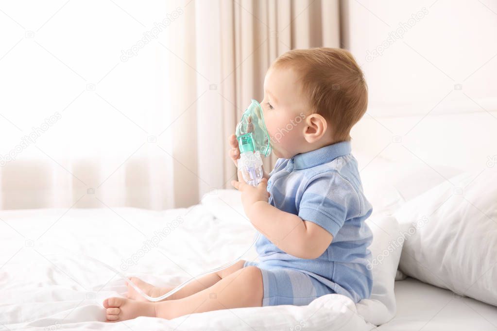 Cute little baby with nebulizer