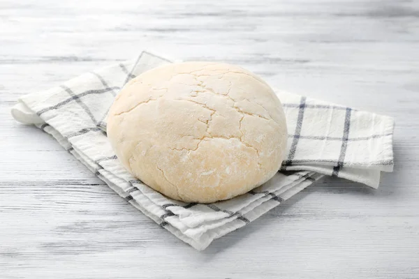 Ball of raw dough and napkin — Stock Photo, Image