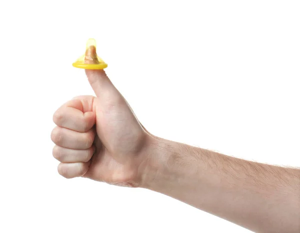Preservativo no polegar masculino — Fotografia de Stock