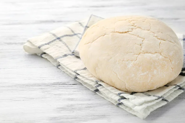 Ball of raw dough and napkin — Stock Photo, Image