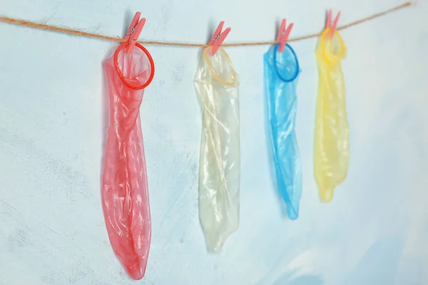 Condoms hanging on rope — Stock Photo, Image