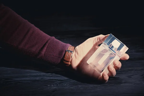 Man with bottle of perfume — Stock Photo, Image