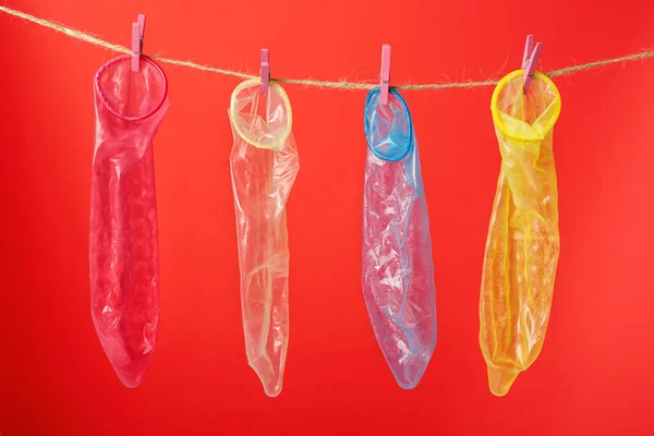 Condoms hanging on rope — Stock Photo, Image