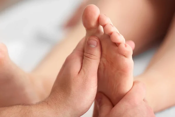 Young woman having foot massage — Stock Photo, Image