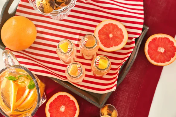 Bottles with refreshing lemonade — Stock Photo, Image