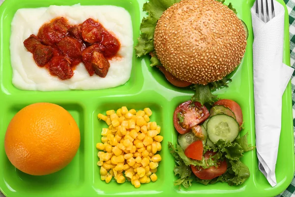 Serving tray with delicious food on table — Stock Photo, Image