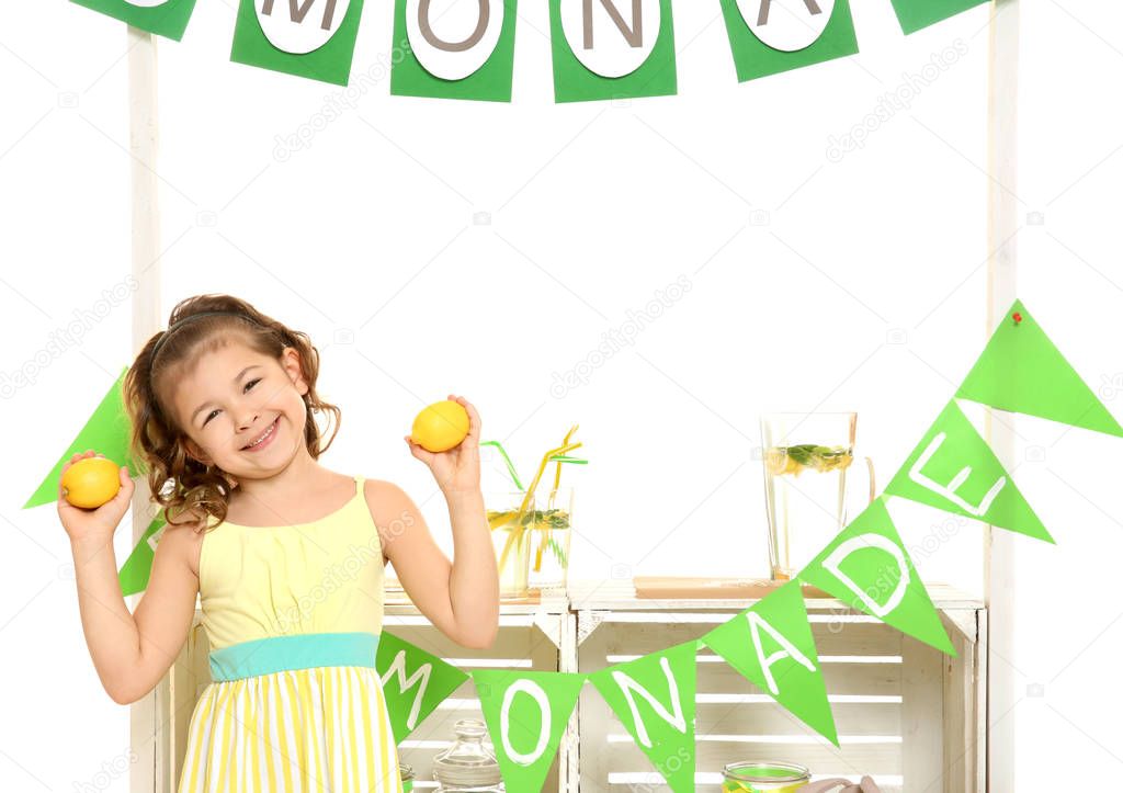 Cute little girl and stand with lemonade