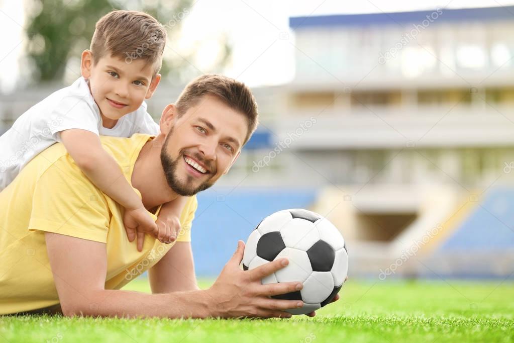 Dad and son with soccer ball