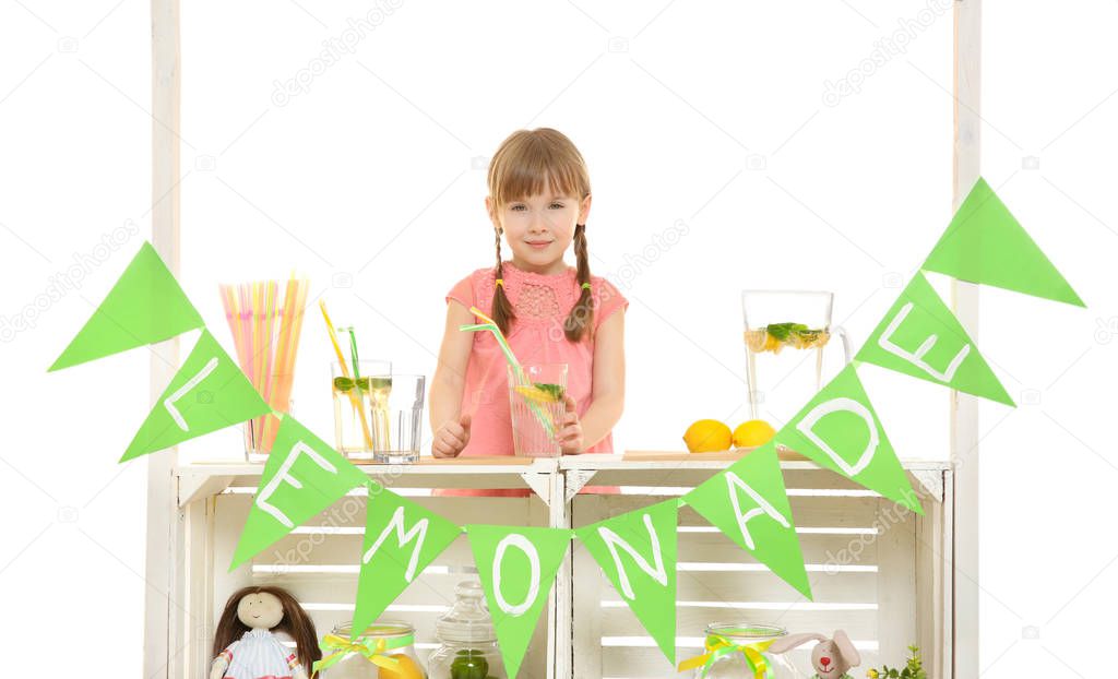 Cute little girl selling lemonade
