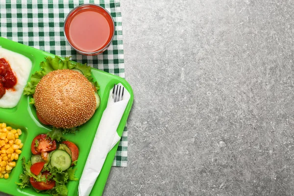 Serving tray with delicious food on table. Concept of school lunch