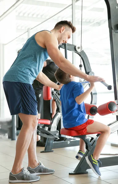 Dad and son in gym