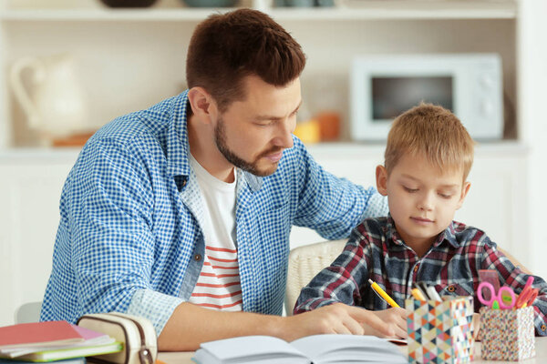 Father and son doing homework