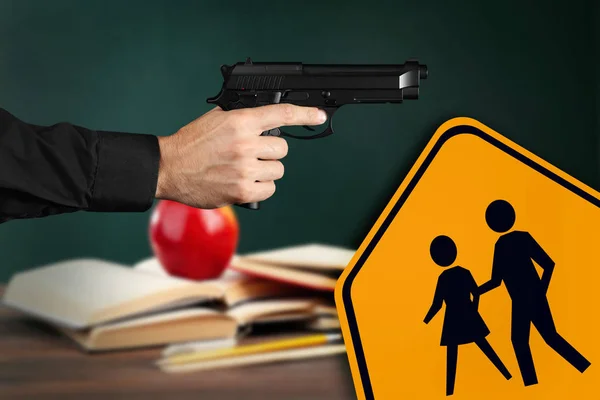 Children crossing sign and man with gun — Stock Photo, Image