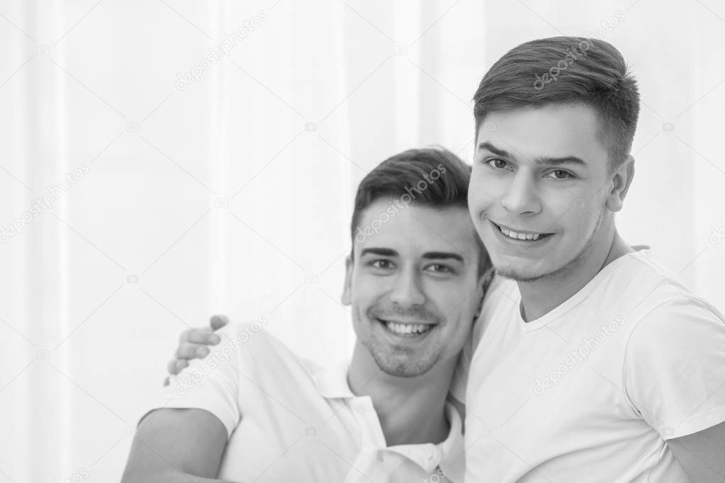 Gay couple on light background