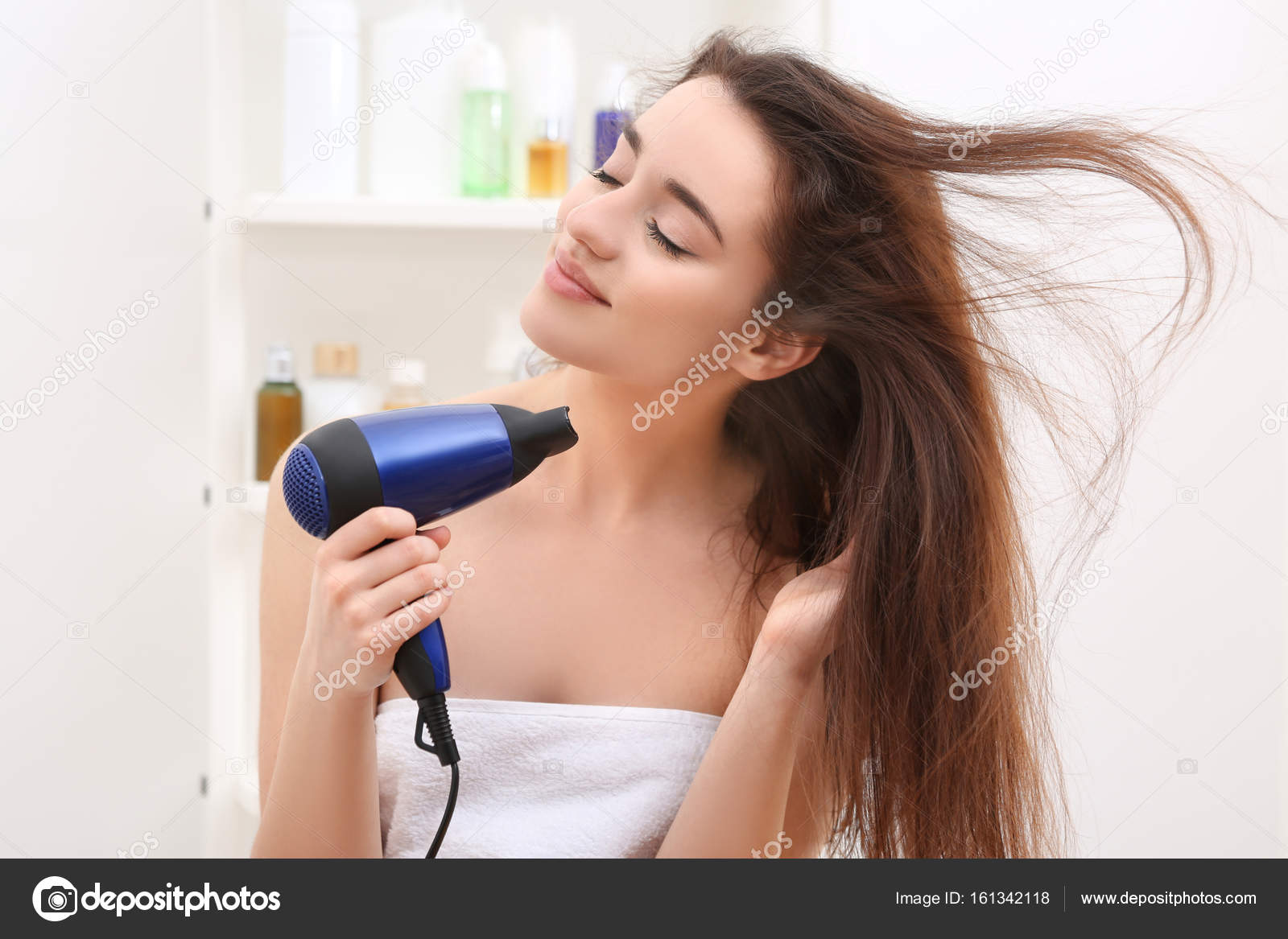 Woman drying hair after shower Stock Photo by ©belchonock 161342118 Woman drying hair after shower Stock Photo by ©belchonock 161342118