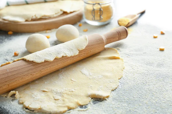 Unleavened dough for tortillas with rolling pin — Stock Photo, Image