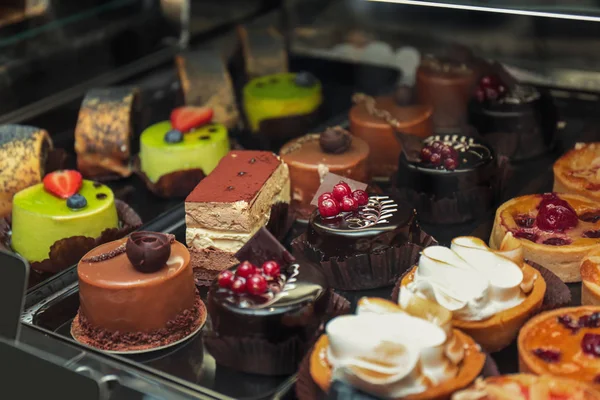 Fridge with delicious cakes