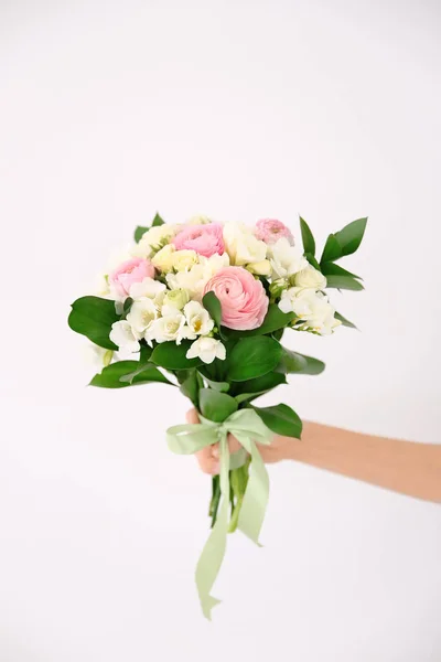 Female hand holding beautiful bouquet — Stock Photo, Image
