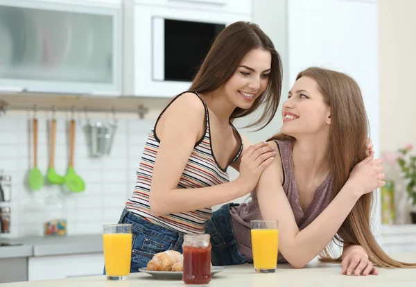 Lesbian couple having breakfast Stock Picture