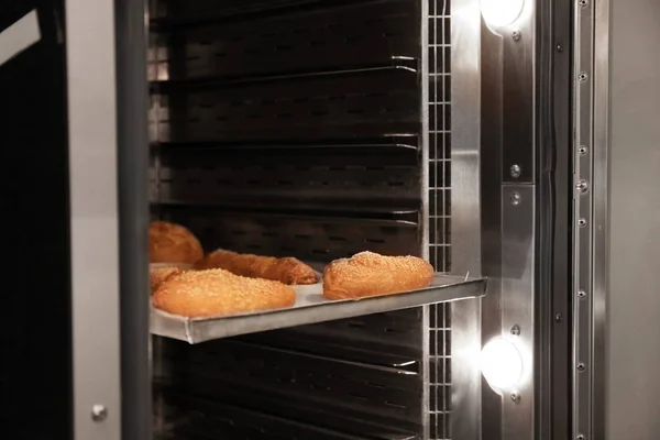 Modern oven with pastry Stock Photo