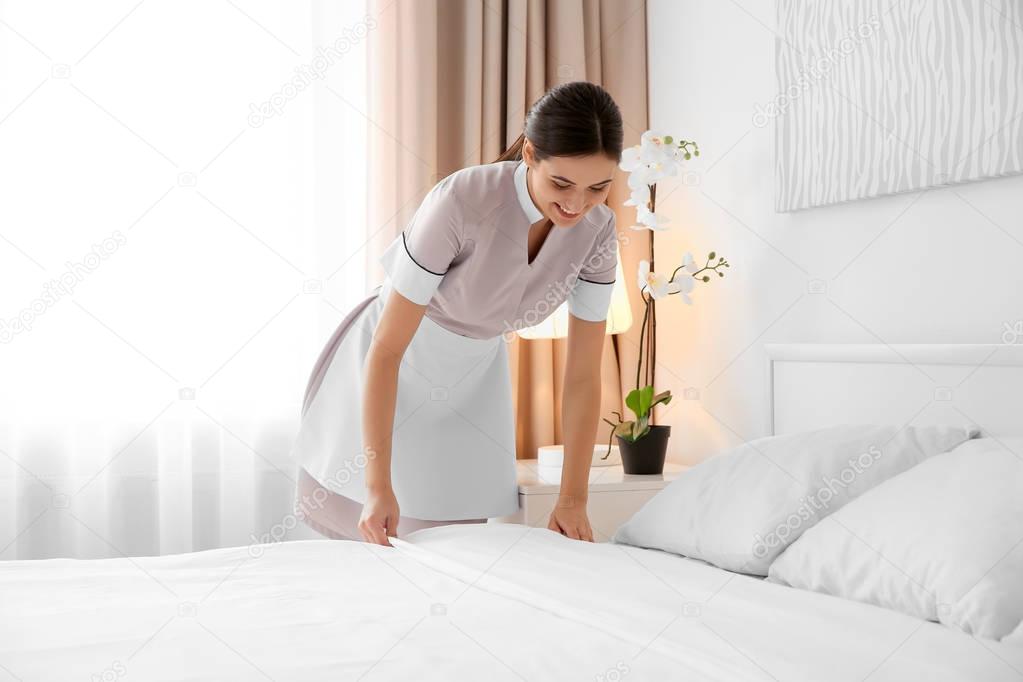 maid making bed