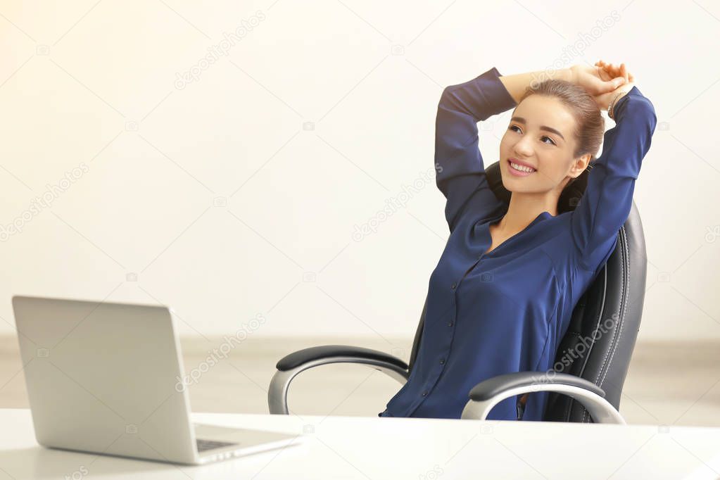 Woman with laptop in office 