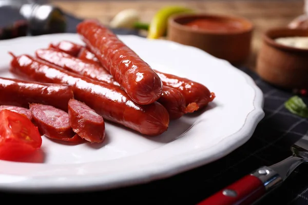 Roasted sausages and tomatoes — Stock Photo, Image