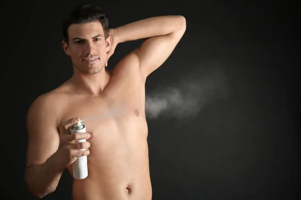 young man with deodorant