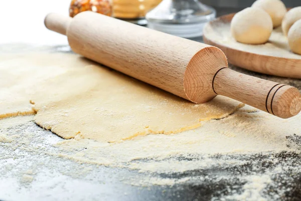 Unleavened dough for tortillas with rolling pin — Stock Photo, Image