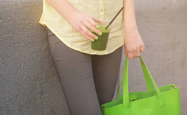 Woman holding cup of smoothie — Stock Photo, Image