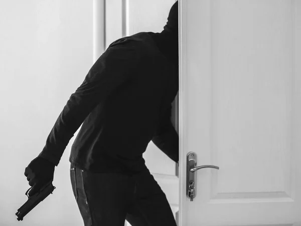 Terrorist with gun entering classroom through door. School shooting concept — Stock Photo, Image