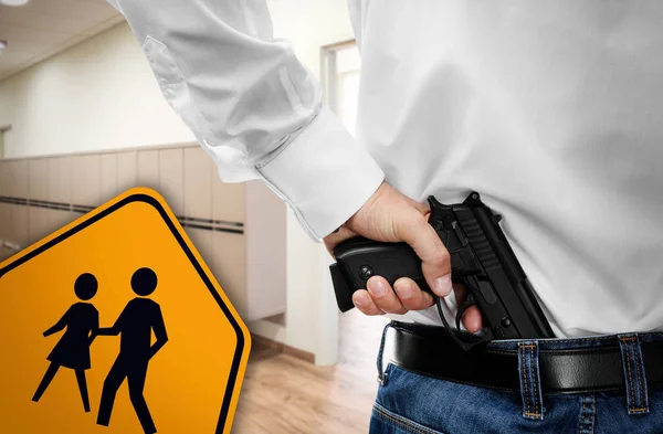 Children crossing sign and man with gun — Stock Photo, Image