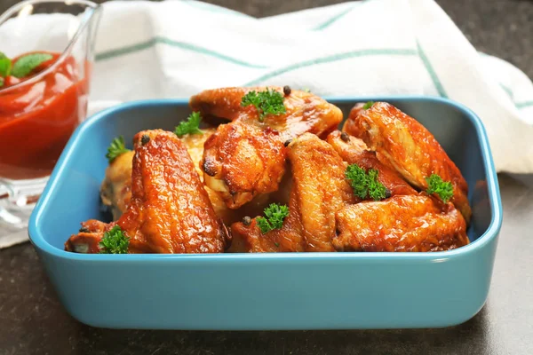 Dish with delicious chicken wings — Stock Photo, Image