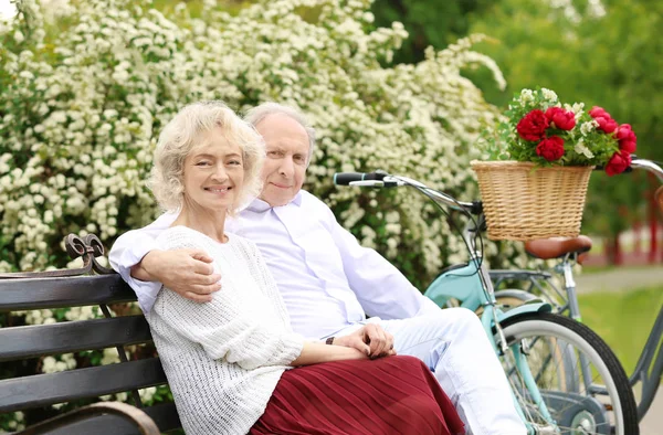 Happy senior couple in park