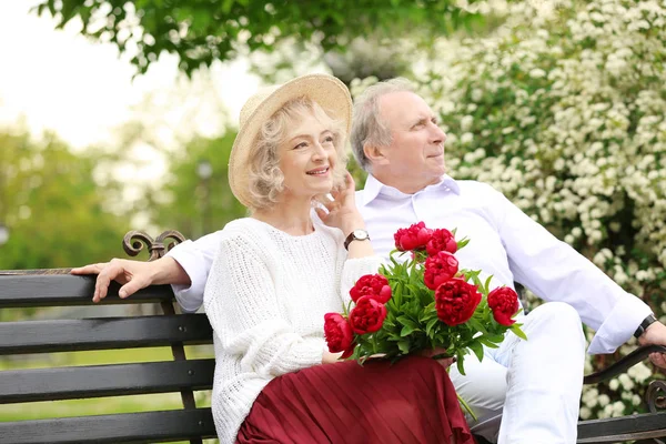 Happy senior couple in park