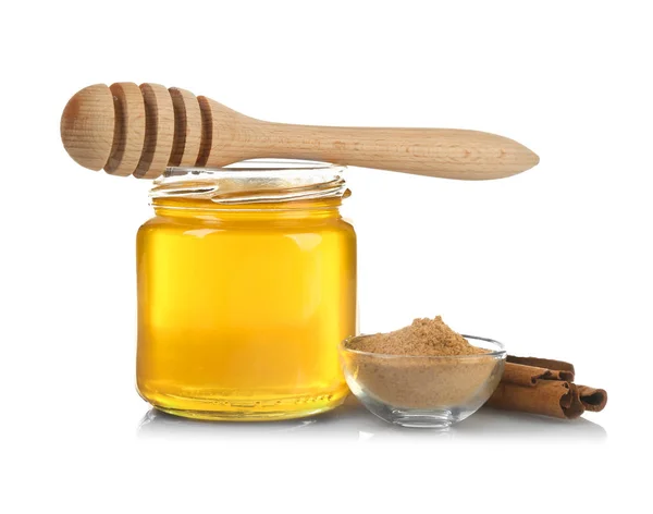 Honey in jar, dipper, cinnamon — Stock Photo, Image