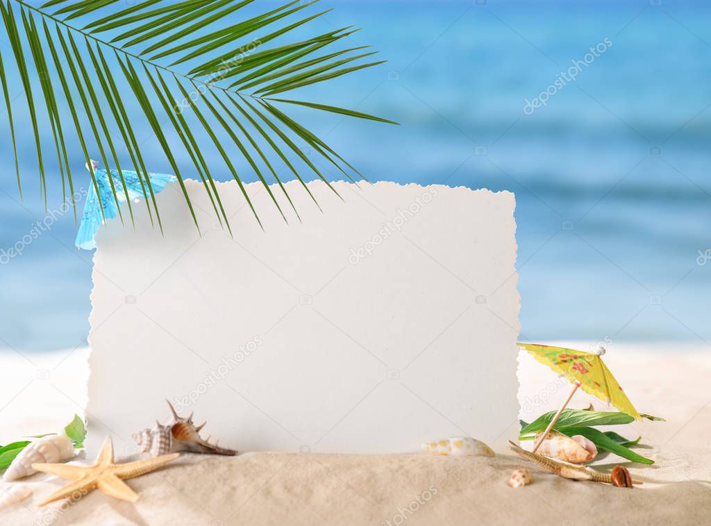 Blank card with sea shells on beach