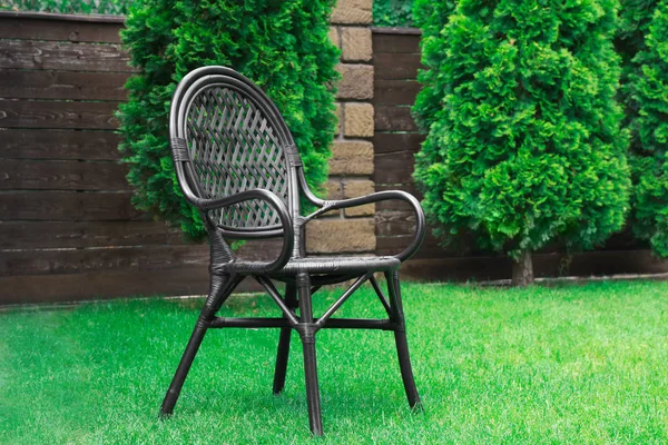Comfortable chair on grass lawn — Stock Photo, Image