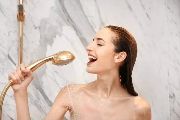 Young woman taking shower — Stock Photo, Image