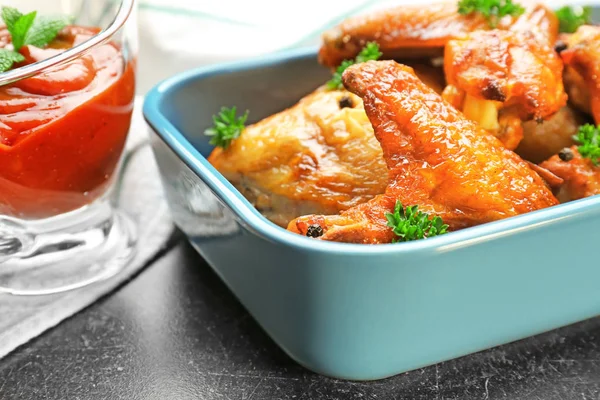 Delicious wings with sauce — Stock Photo, Image