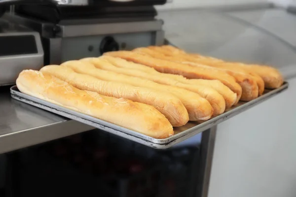 Tray with baguettes on table — Stock Photo, Image