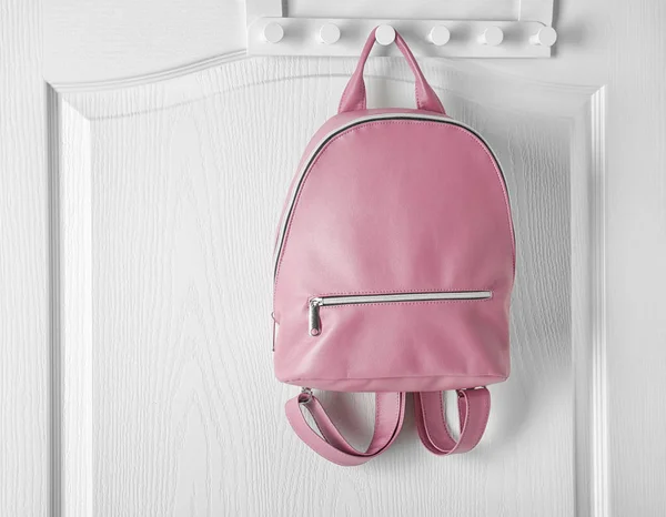 Hanger with leather backpack — Stock Photo, Image