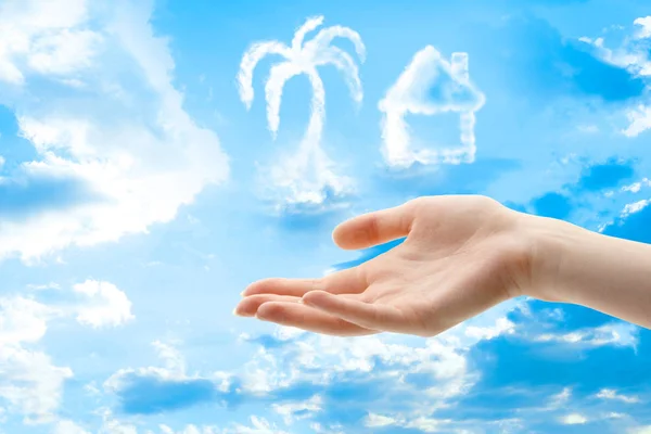 Female hands and clouds of different shapes — Stock Photo, Image