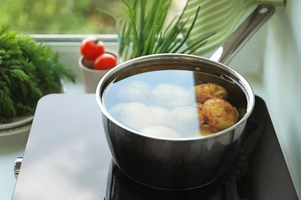 Metal pot with potato — Stock Photo, Image