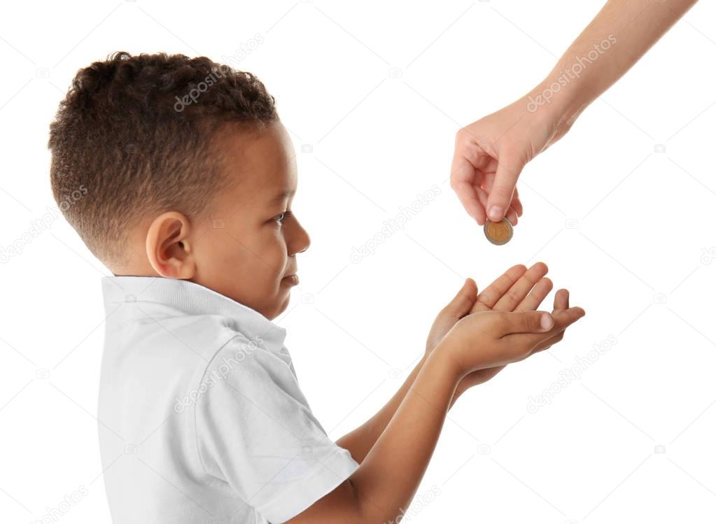 Cute little boy asking for handout on white background. Poverty concept