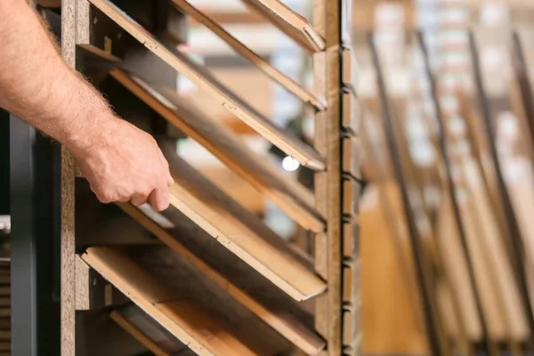 Carpenter choosing laminate samples — Stock Photo, Image