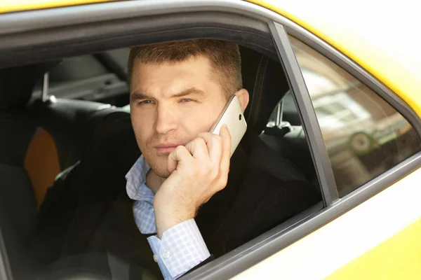 Handsome man talking on phone — Stock Photo, Image