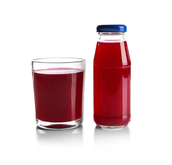 Botella y vaso con delicioso jugo — Foto de Stock