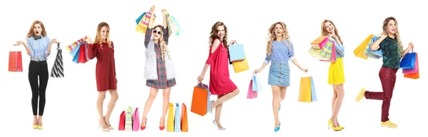 Mooie vrouwen met boodschappentassen op witte achtergrond — Stockfoto