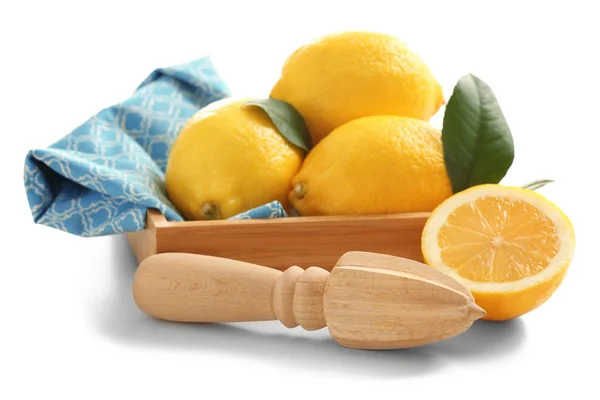 Wooden box with juicer and lemons — Stock Photo, Image